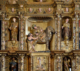 Baroque altarpiece with the image of Saint Martin sharing his cloak with a beggar