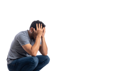 Person sitting with head in hands symbolizing anxiety or sadness, isolated on white background in Png format