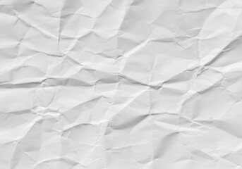 Fototapeta premium Close-up of a wrinkled white sheet of paper showing texture and shadows