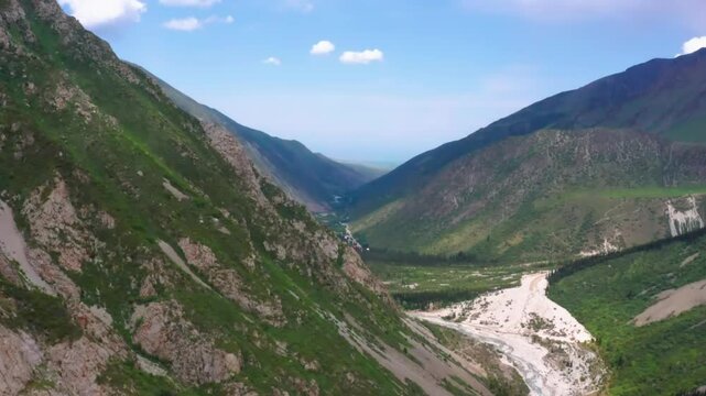 This footage depicts a section of Ala Archa National Park, showcasing the breathtaking mountainous landscape with rugged peaks and vast alpine views.