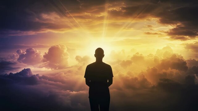 Silhouette of man facing bright sunset. Mental health concept. Overcoming depression, finding hope and inner peace. Spiritual awakening and self-discovery journey.