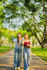 Obraz premium Study of portraits and female students at a university park to learn or study, scholarship books and laptops.