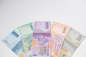 Collection of Indonesian rupiah banknotes isolated on white background, selective focus