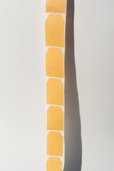 Blank beige sticky notes on white background