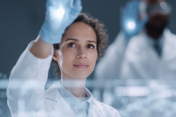 diverse group of women scientists collaborating in modern laboratory showcasing their innovative technologies and