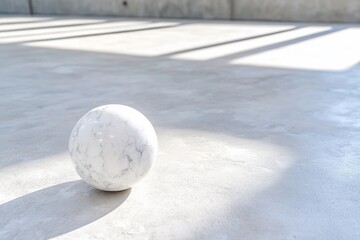 Marble sphere on concrete floor