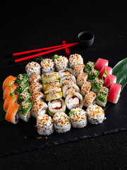 tasty sushi on the black background