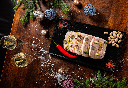 Christmas antipasti meat loaf made of chicken terrine,