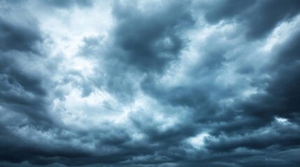 Dramatic dark grey storm clouds fill the sky, creating a moody and intense atmospheric scene.  Heavy cloud formations suggest impending rain or a powerful weather system. : Generative AI
