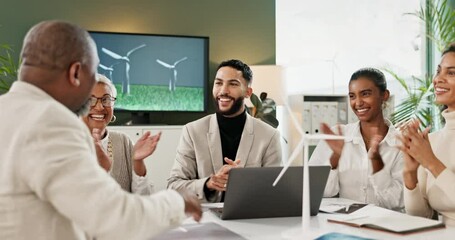 Deal, handshake and wind turbine model with business people in office boardroom for presentation. Meeting, partnership and success with applause for shaking hands in agreement, thank you or welcome