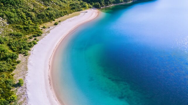 Aerial view of a secluded, crescent-shaped beach with pristine white sand meeting turquoise and deep blue ocean water, surrounded by lush green vegetation. : Generative AI