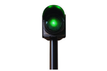 Illuminated Green Traffic Light Signal on a Pole at Night A Close Up View of a Modern Traffic Control Device