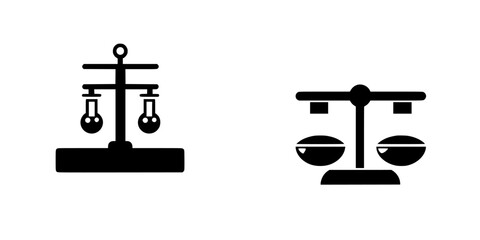 Flat black icon representing balance scales symbolizing justice and fairness in law and ethics