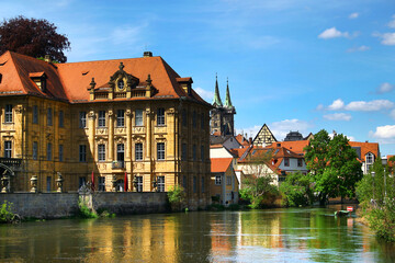 Historic Bamberg by the Regnitz River under a Clear Spring Sky in Bavaria, Germany