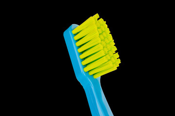 Toothbrush isolated on black background, macro.