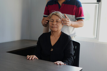 Showing the helping hands between Physiotherapist doctor and elderly patient, empathy and...