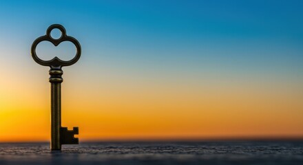 Obraz premium A Golden Key to New Beginnings at Sunrise: Symbol of Opportunity and Hope