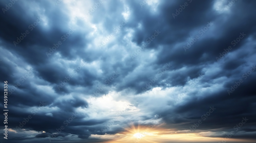Aufkleber dramatic sunset scene with dark, brooding cloudscape and a radiant sun breaking through, creating a 