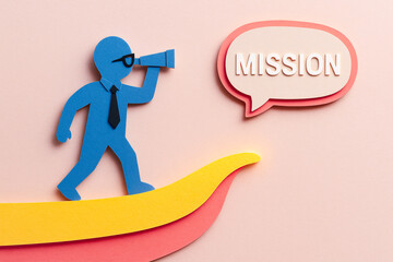 Blue paper cutout of business person with tie holding telescope symbolizing business vision and planning for mission success on pastel background