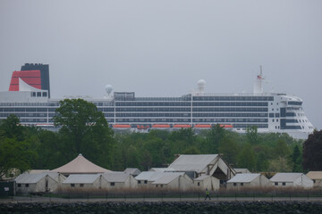 Luxury ocean liner cruiseship cruise ship Queen Mary docked at terminal in Brooklyn on grey rainy...