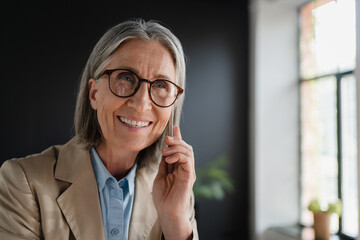 Smile, woman and phone call in office with laptop for work as receptionist, administrative support...
