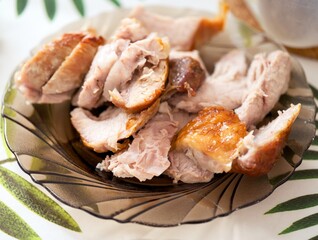 Chopped pieces of cooked pork on a plate