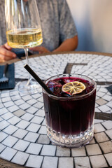 Sipping refreshing cocktails and wine in a trendy cafe, surrounded by mosaic artistry