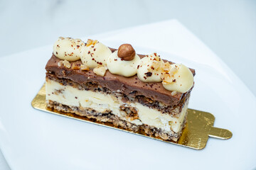 This delightful dessert showcases layers of creamy chocolate and rich flavors, garnished elegantly