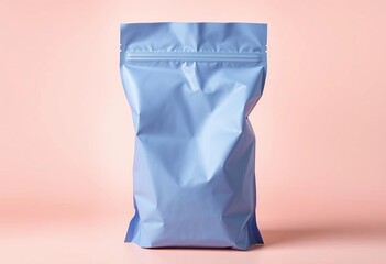 Empty blue zip-top food bag stands upright on pastel background, bright, cyan