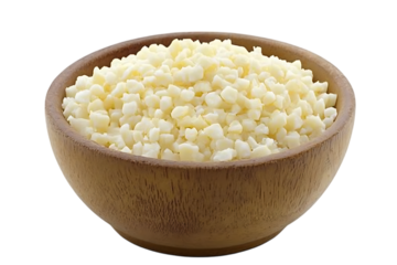Diced mozzarella cheese in wooden bowl against transparent background