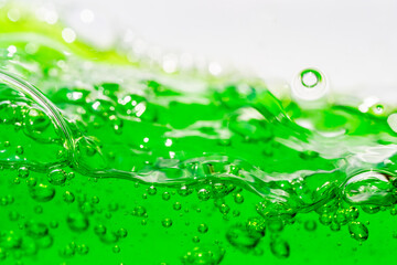 Water wave, close up of vibrant green liquid with bubbles, capturing dynamic movement and...