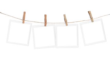 Four blank instant photo frames hanging on a rope, isolated on white or transparent background, png cut out