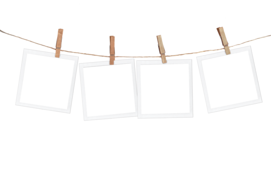Four blank instant photo frames hanging on a rope, isolated on white or transparent background, png cut out