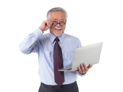 Senior Asian businessman with glasses smiling while holding laptop, adjusting spectacles, wearing formal shirt and tie, isolated on transparent background, concept successful professional elderly man