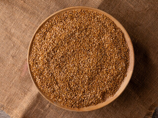 Organic golden flaxseed, linseed grains. Superfood high in fiber.