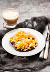 scramble eggs with black bread on dish