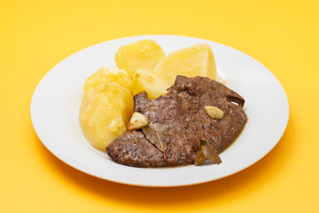 Fried Liver with boiled potato on plate