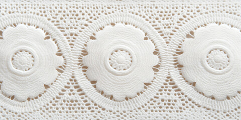 Intricate floral lace trim, delicate detailing. White fabric with flower pattern, creating a visually appealing texture. Floral crochet pattern.