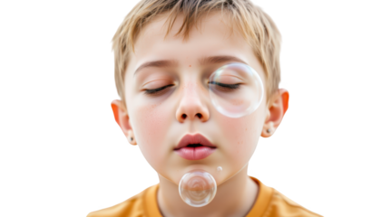 Playful little boy blowing bubbles with his nose, a whimsical childhood moment young