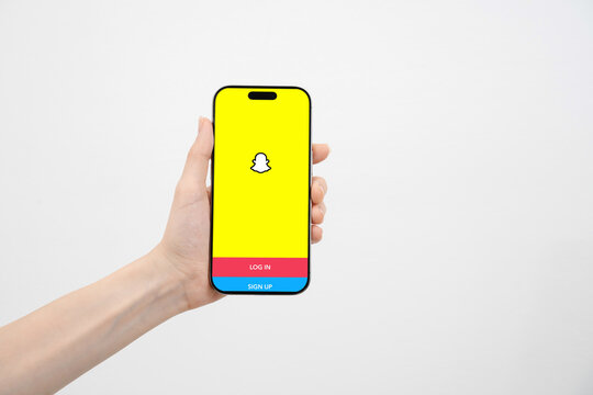 In this photo illustration, the Snapchat logo is displayed on a smartphone screen.