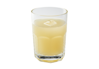 Refreshing drink with ice cube in a faceted glass on a black background