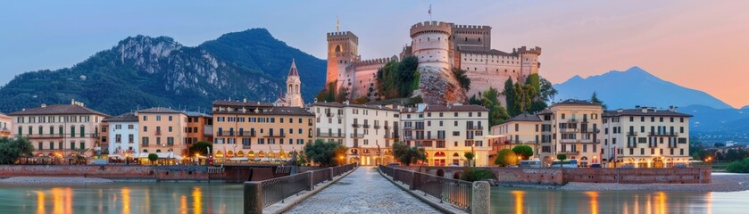 Fototapeta premium Scenic castle with mountains and water at sunset.