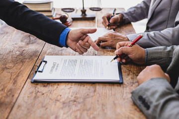 Lawyer mediating dispute, two litigants and businessmen in law office. Signing a contract agreement legal.