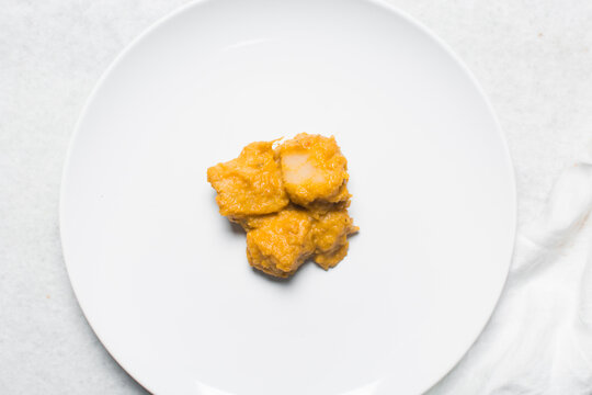 Overhead view of nigerian yam porridge, top view of nigerian asaro on a white backgroundOverhead view of nigerian yam porridge, top view of nigerian asaro on a white background