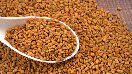 Methi or fenugreek seeds with methi leaves.Methi seeds is good for health.
