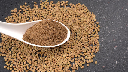 Methi or fenugreek seeds with methi leaves.Methi seeds is good for health.

