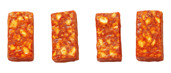 Four rectangular blocks of Indonesian tempeh featuring soybeans and spices are arranged vertically isolated on a transparent background for.