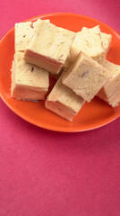 Patisa / Soan Papdi is a popular Indian cube shape flaky/crispy dessert. 
