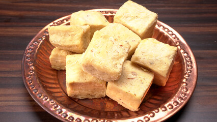 Patisa / Soan Papdi is a popular Indian cube shape flaky/crispy dessert. 
