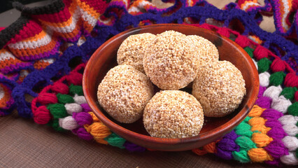 Amarnath seed, Cholai or Rajgira laddo, Also in cube shape called chikki or cake form, Indian sweet and healthy food served in a plate and bowl. Selective focus.